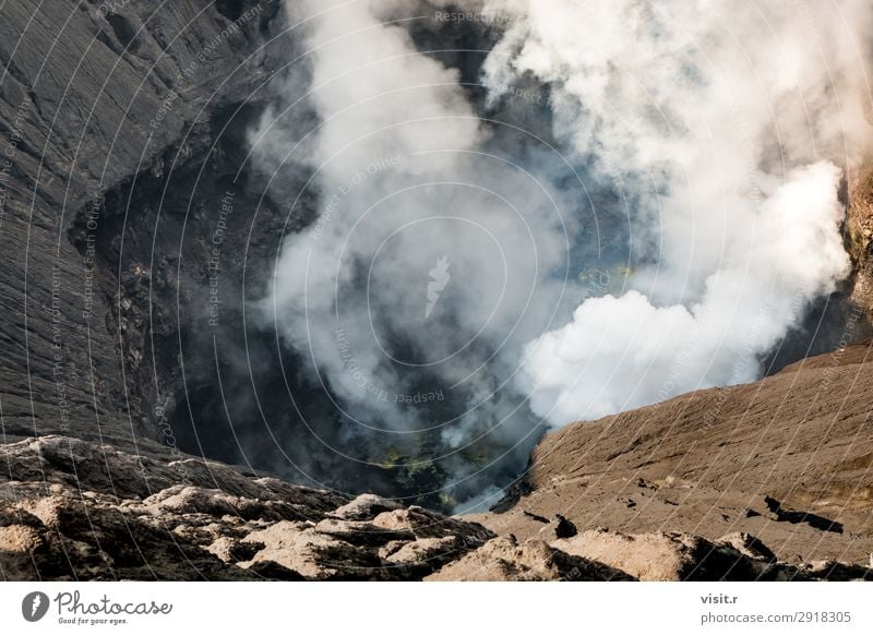 Crater of Bromo volcano with erupting smoke Vacation & Travel Tourism Trip Adventure Summer Mountain Hiking Environment Nature Landscape Sky Fog Park Rock