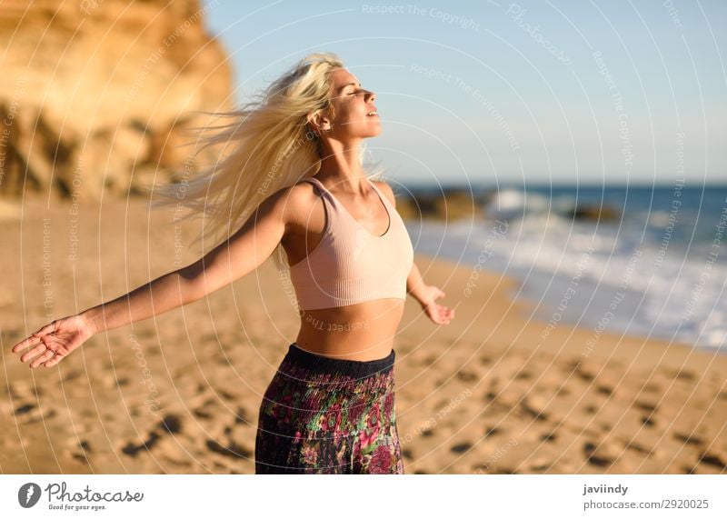 Woman enjoying the sunset on a beautiful beach Lifestyle Happy Beautiful Body Relaxation Leisure and hobbies Vacation & Travel Freedom Summer Sun Beach Ocean