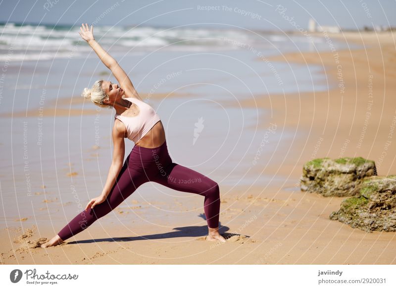 Caucasian blonde woman practicing yoga in the beach Lifestyle Beautiful Body Harmonious Relaxation Meditation Summer Beach Ocean Sports Yoga Human being