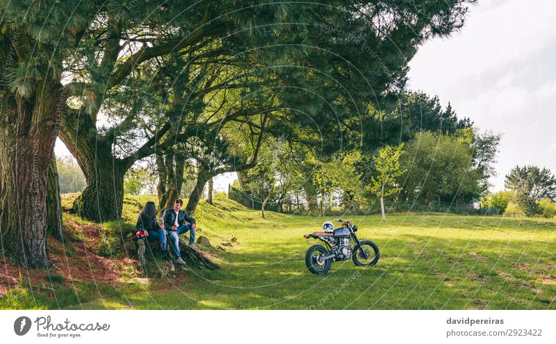 Couple resting from a motorcycle trip Drinking Cold drink Alcoholic drinks Beer Lifestyle Happy Vacation & Travel Trip Human being Woman Adults Man Nature