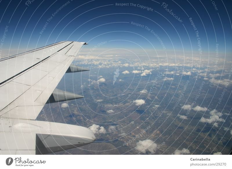 Between heaven and earth Airplane Clouds Horizon Azure blue Wing Vacation & Travel Flying Aviation Earth