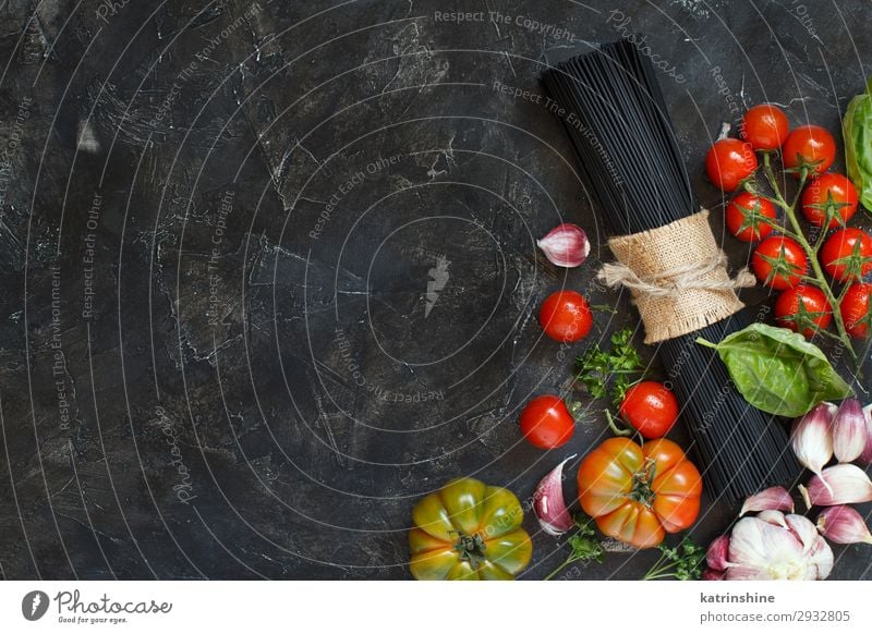 Raw squid ink pasta and vegetables Vegetable Modern Green Red Black White Squid ink Spaghetti Italian Tomato cherry tomatoes Ingredients Basil Garlic oil