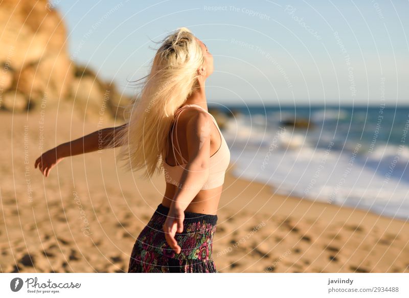 Woman enjoying the sunset on a beautiful beach Lifestyle Happy Beautiful Body Relaxation Leisure and hobbies Vacation & Travel Freedom Summer Sun Beach Ocean