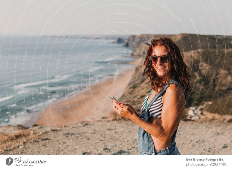 portrait of beautiful happy young woman outdoors Lifestyle Happy Beautiful Relaxation Vacation & Travel Summer Sunbathing Beach Ocean To talk Telephone