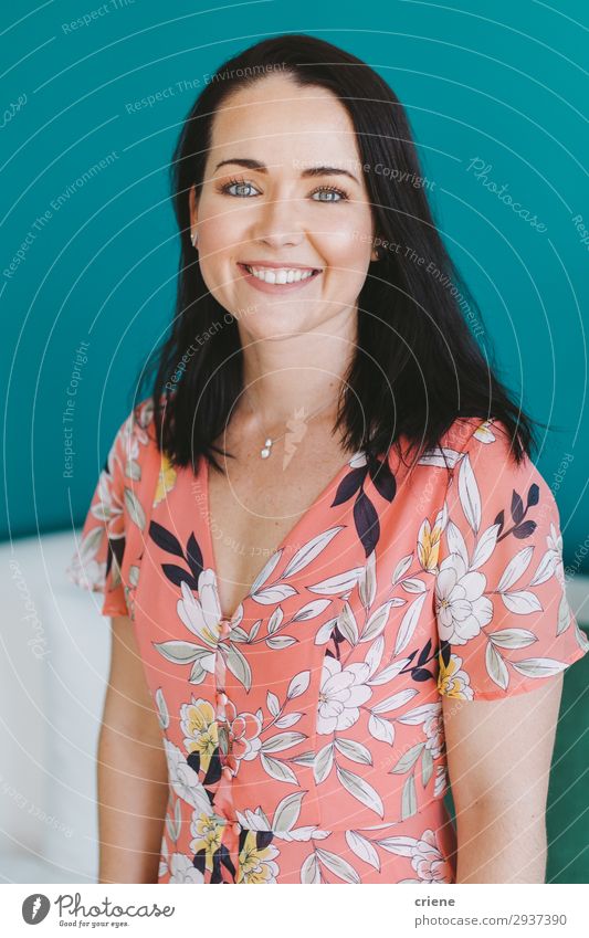 Headshot of smiling young female woman Happy Woman Adults Brunette Smiling Blue Self-confident positive Caucasian Interior shot Portrait photograph