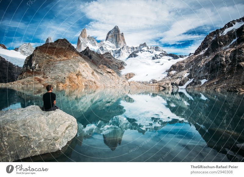 Man in front of lake and mountain - Fitz Roy Nature Blue Gray Black Turquoise White Fitz Roy mountain Mountain Mountain lake Argentina Stone Sit Marvel To enjoy