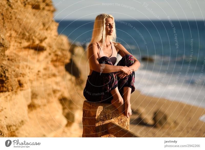 Woman enjoying the sunset on a beautiful beach Lifestyle Happy Beautiful Body Relaxation Meditation Leisure and hobbies Vacation & Travel Freedom Summer Sun