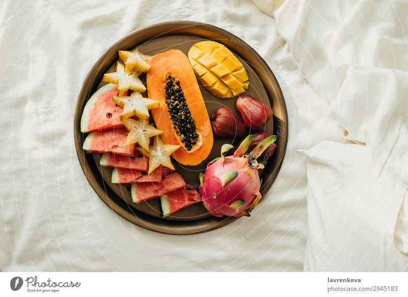 Various exotic tropical fruits on a metal tray in bed Bedroom Breakfast Carambole Cut Delicious Dessert Diet Dragonfruit Exotic flat flatlay Food Healthy Eating