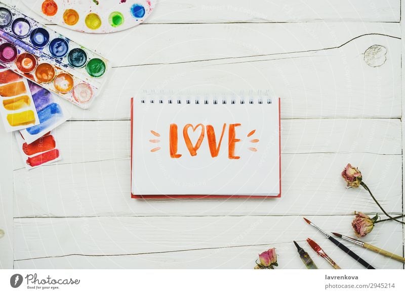 sketchbook with handlettering inscription "Love" Notebook Artist Brush Business Multicoloured Conceptual design Creativity Decoration Design Desk