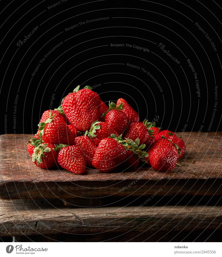 bunch of fresh ripe red strawberries Fruit Dessert Table Nature Leaf Wood Dark Fresh Small Delicious Natural Juicy Red Black Strawberry sweet Berries bush food