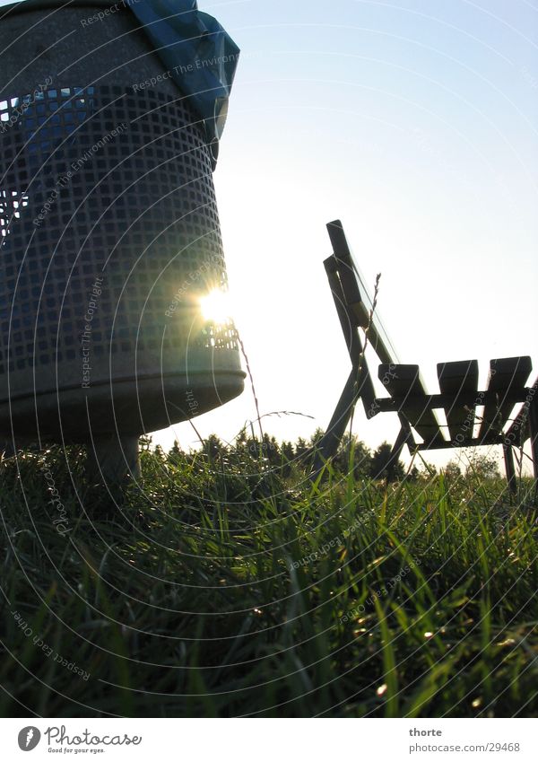 Sun in the bucket Trash container Dike Grass Back-light Leisure and hobbies Bench Sky