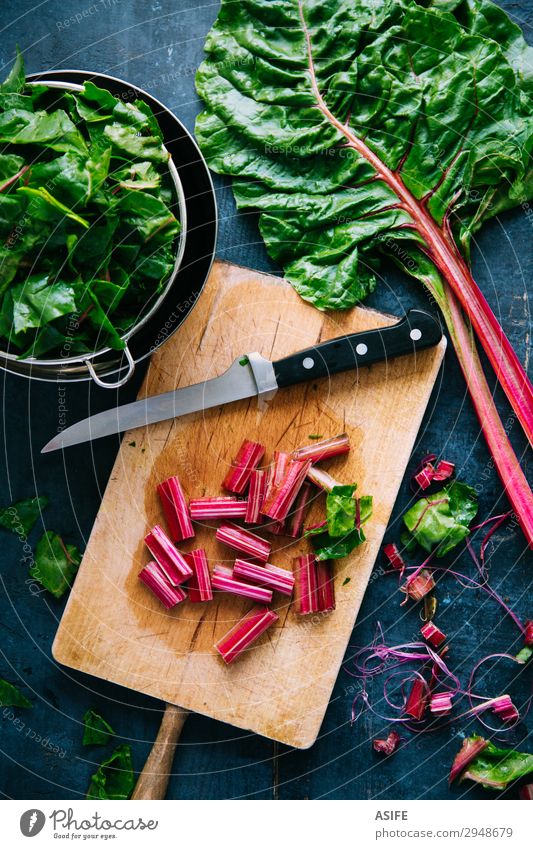 Cooking healthy swiss chard Vegetable Nutrition Vegetarian diet Diet Bowl Beautiful Leaf Sieve Wood Fresh Blue Green Red rainbow chard preparing cooking