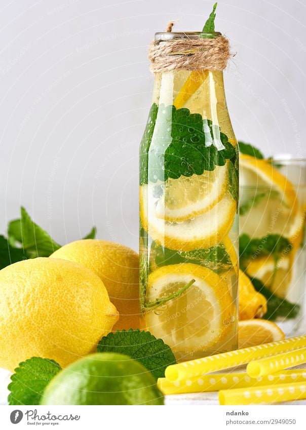 summer refreshing drink lemonade with lemons Fruit Herbs and spices Vegetarian diet Beverage Cold drink Lemonade Juice Alcoholic drinks Bottle Summer Table Leaf