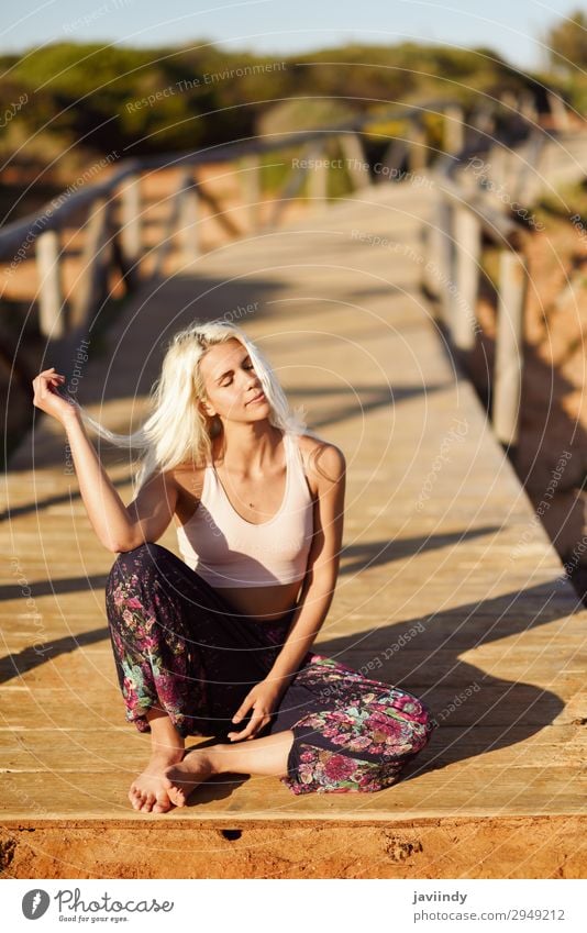 Smiling woman enjoying the sunset on a beautiful beach Lifestyle Happy Beautiful Body Leisure and hobbies Vacation & Travel Freedom Summer Sun Beach Ocean