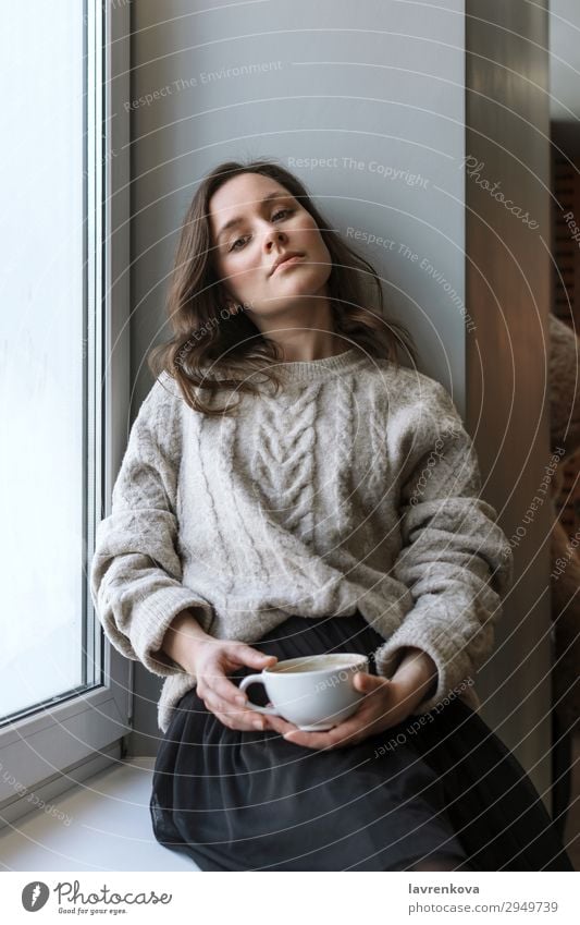 woman in sweater holding cup with latte Attractive Café Casual clothes Caucasian Close-up Coffee Cup Beverage Drinking Woman Shallow depth of field Young woman