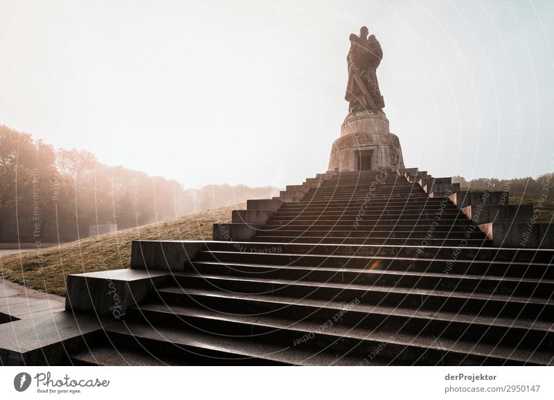 Soviet memorial in Treptow in Berlin berlinerwasser Joerg farys Wide angle Long shot Central perspective Deep depth of field Back-light Sunrise Sunbeam Sunlight