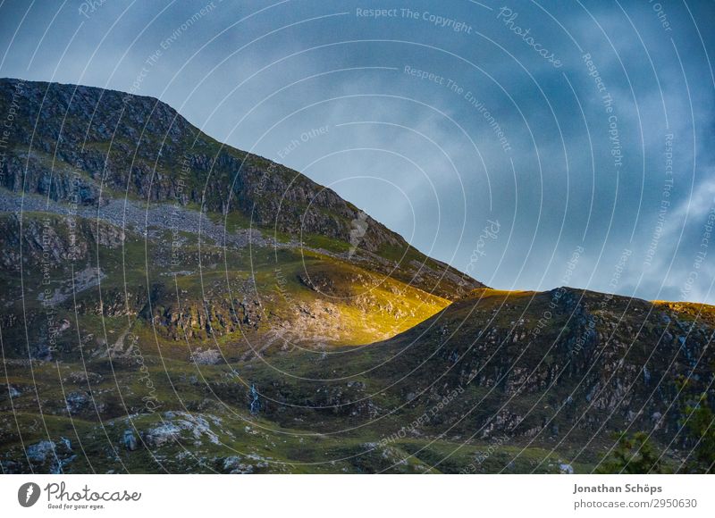 last sunbeam at the mountain Highlands, Scotland Environment Nature Landscape Elements Sky Sunrise Sunset Sunlight Beautiful weather Rock Mountain Esthetic