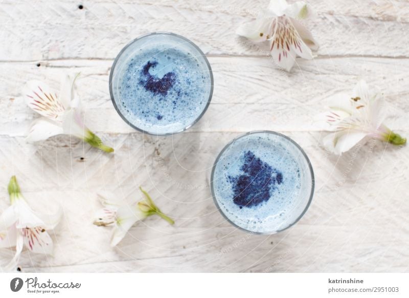 Blue matcha milk Breakfast Vegetarian diet Bowl Flower Natural Above White blue matcha foam Froth latte butterfly pea Powder drink antioxidant flat lay Dried