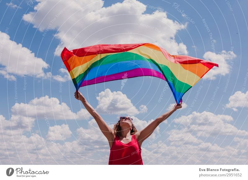 Woman holding the Gay Rainbow Flag over blue sky Lifestyle Joy Happy Leisure and hobbies Freedom Summer Sun Wedding Human being Feminine Homosexual Young woman