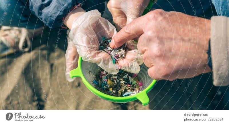 Colander with microplastics on the beach Beach Child Internet Human being Woman Adults Man Grandfather Family & Relations Hand Environment Sand Sieve Plastic