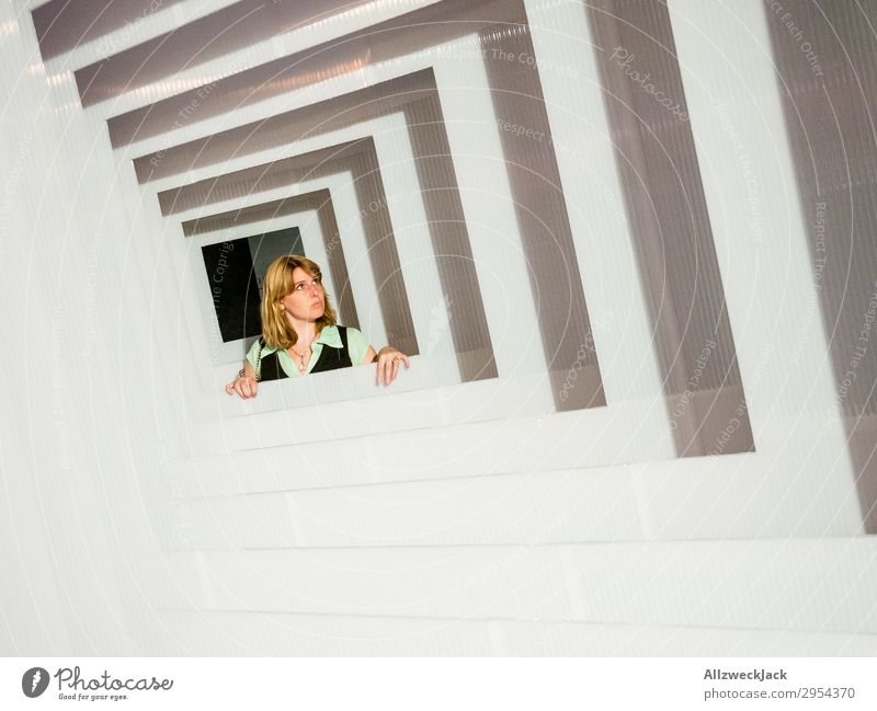 Portrait of a young woman in several frames 1 Person Young woman Portrait photograph Central perspective Frame Tunnel Interior shot Studio shot Illusion Joy