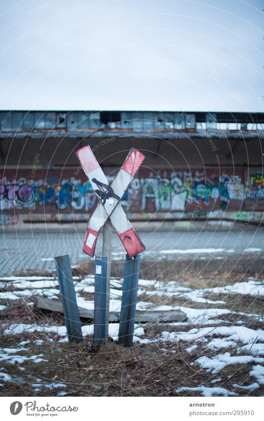 railroad crossing Winter Ice Frost Snow Grass Berlin Germany Town Deserted Industrial plant Transport Logistics Road sign Rail transport St. Andrew's Cross