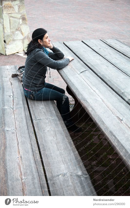 Attractive woman in a bizarre scene on an oversized bench for giants Vacation & Travel Human being Feminine Woman Adults Places Jeans Black-haired Wood Observe