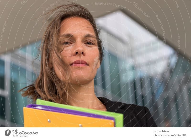 Woman with colourful folders in front of office building Education Science & Research Study Professor Office work Economy Services Business Career Adults