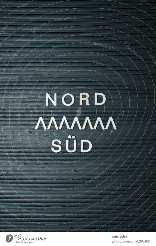 North - South Sign Characters Digits and numbers Ornament Signs and labeling Vacation & Travel Write Thorny Black Aggression War Mobility Politics and state