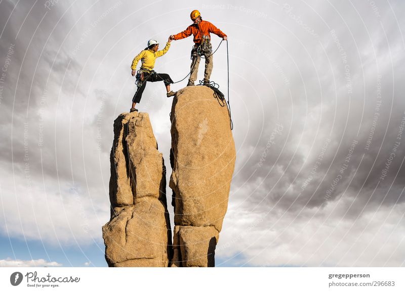 Conquering the summit. Adventure Climbing Mountaineering Partner 2 Human being 30 - 45 years Adults Storm Peak Helmet Success Self-confident Brave Determination