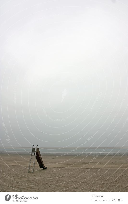 slide tour Sand Clouds Bad weather Coast Beach North Sea Island Langeoog Toys Slide Loneliness Infancy Colour photo Subdued colour Exterior shot Copy Space top