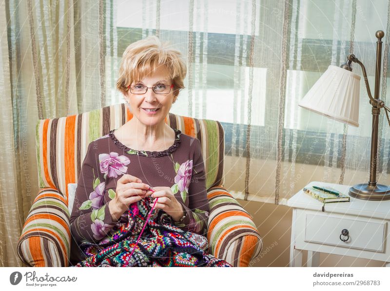 Portrait of woman knitting a vintage wool quilt Relaxation Leisure and hobbies Knit Work and employment Craft (trade) Human being Woman Adults Mother