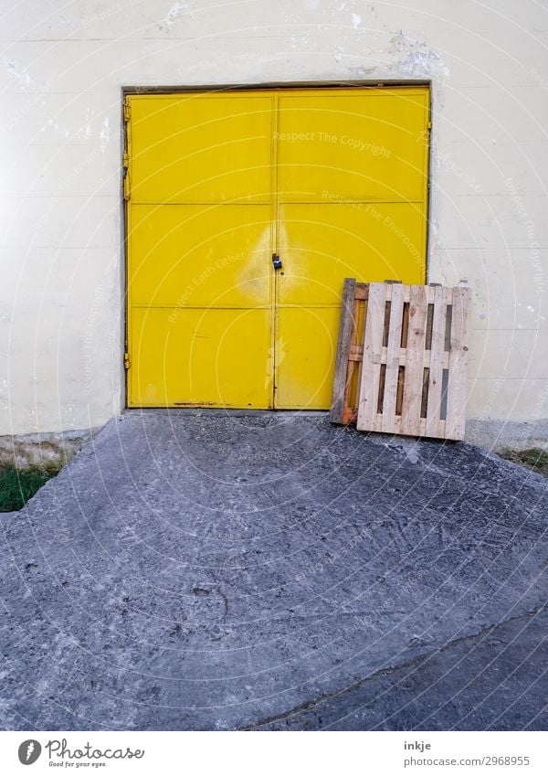 Cuban garage door Deserted Gate Garage door Warehouse Door Expressway exit Ramp Palett Simple Yellow Closed Ajar Colour photo Exterior shot Day Light Shadow