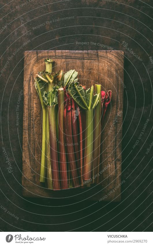 Rhubarb bundles on cutting board Food Vegetable Fruit Nutrition Organic produce Vegetarian diet Style Design Healthy Healthy Eating Table Nature