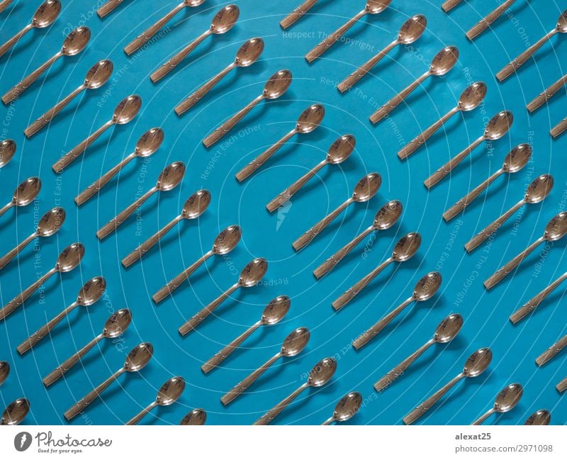 Silver spoons pattern on blue background Breakfast Lunch Dinner Cutlery Spoon Decoration Kitchen Restaurant Tool Art Blue Café cook cooking eat food Horizontal