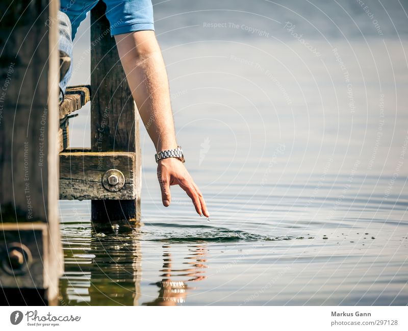 Relax at the lake Lifestyle Harmonious Well-being Contentment Senses Relaxation Calm Vacation & Travel Summer Sun Masculine Arm Hand Nature Water Lakeside Fluid