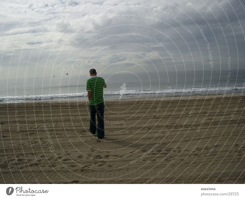 friend 5 meters in front of me Beach California Malibu Water Sand Sandy beach Young man Rear view Coast Pacific Ocean Horizon Clouds in the sky Cloud field