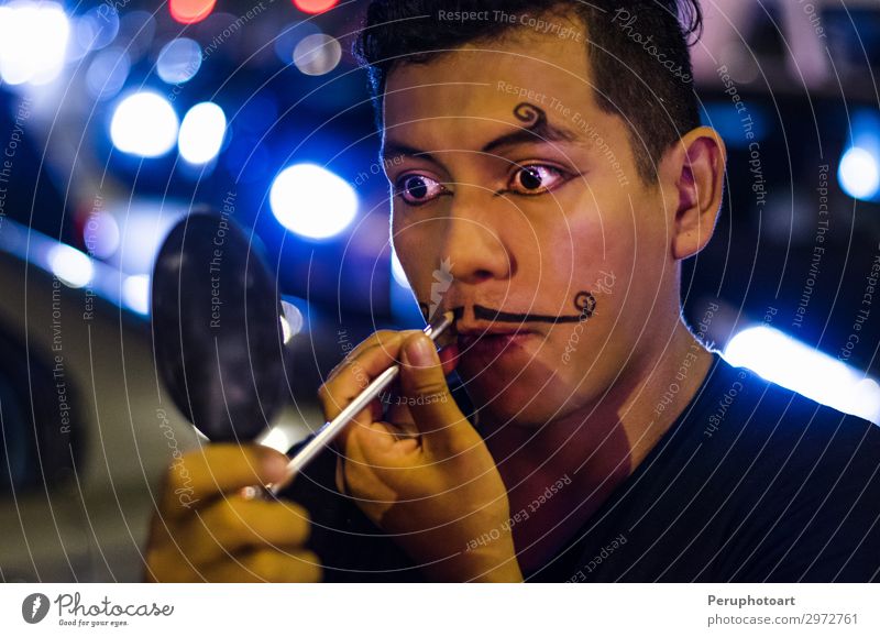 Portrait of a young clown putting on mustaches with makeup Joy Happy Face Make-up Rouge Mirror Child Human being Man Adults Actor Circus Street Bow tie Laughter