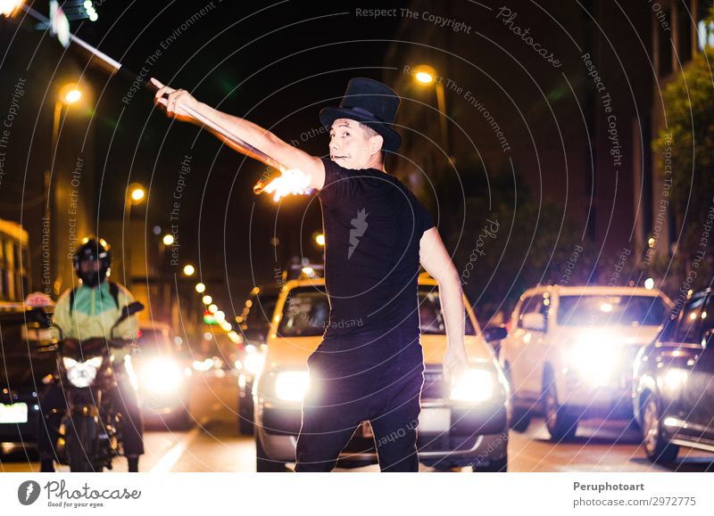 A street artist who makes a show in Lima - Peru, juggling a stick with fire at traffic lights stops Lifestyle Style Beautiful Playing Audience Human being