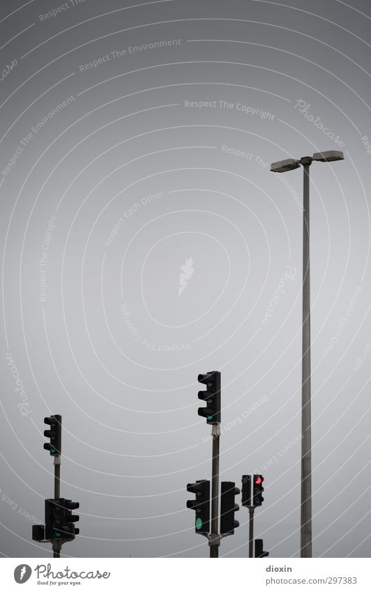 rømø | traffic lights Sky Bad weather Transport Crossroads Traffic light Lamp post Street lighting Driving Wait Gray Town Colour photo Exterior shot Deserted