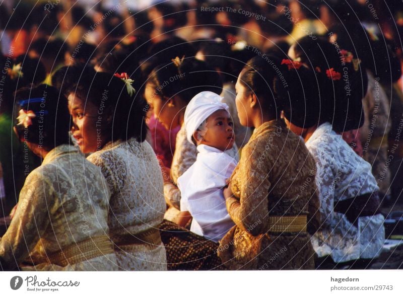 Flying Flowers and a white Child Indonesia Ceremony Prayer Mother Group Boy (child)