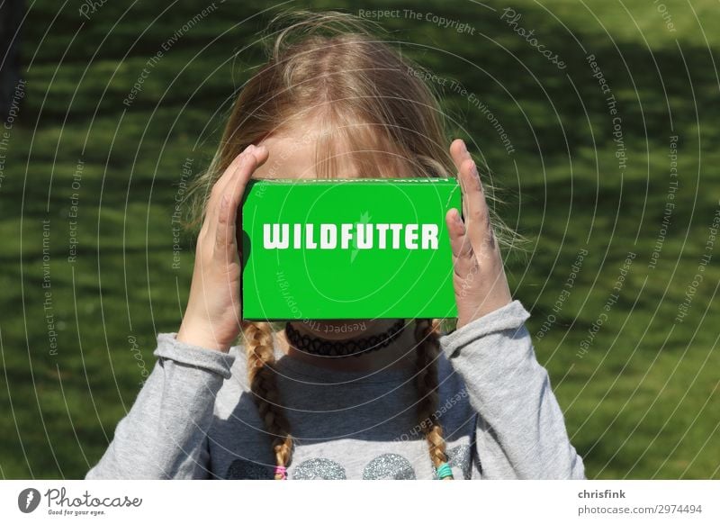 Child holds box of wild food Human being Feminine Girl Body 1 8 - 13 years Infancy Park Animal Feeding Green Joy Zoo Wild Colour photo Exterior shot Day