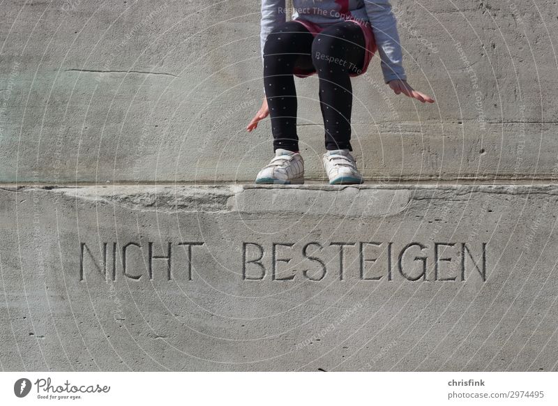 Child plays on stairs with warning sign Climbing Mountaineering Parenting Education Girl Feet 1 Human being 8 - 13 years Infancy Tourist Attraction Monument