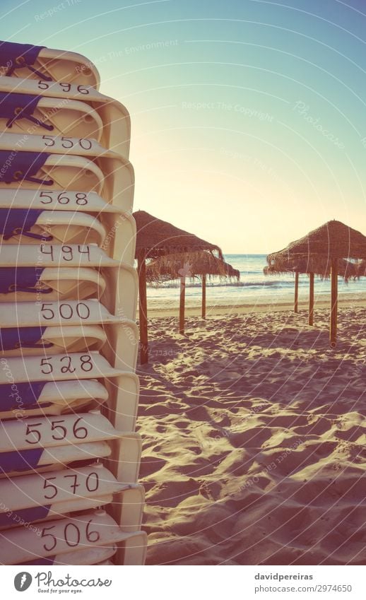 Beach chairs and wooden umbrellas in empty beach Exotic Beautiful Relaxation Vacation & Travel Tourism Summer Sun Ocean Island Chair Nature Landscape Sand Sky