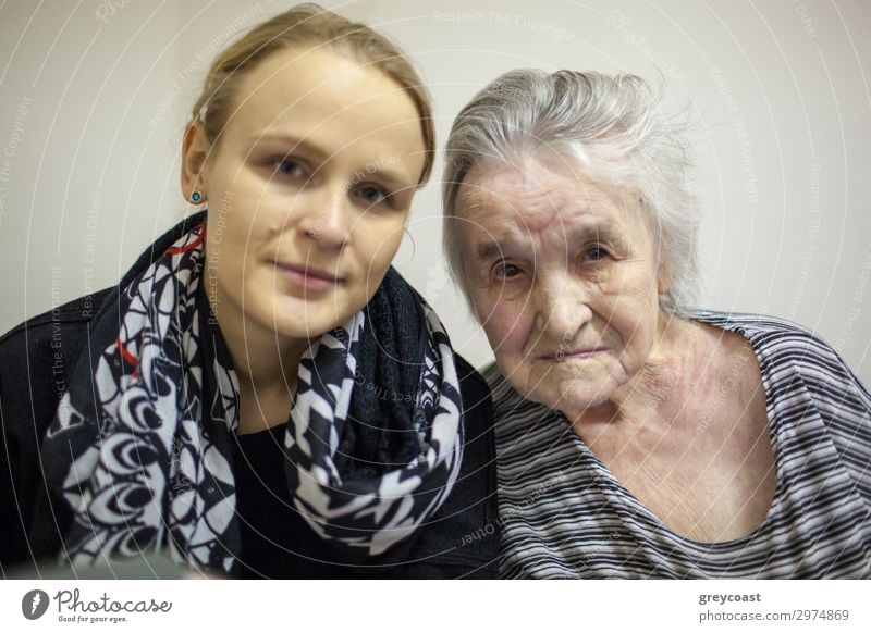 A double portrait of a young woman and her grand mother Life Human being Feminine Young woman Youth (Young adults) Woman Adults Female senior Grandmother