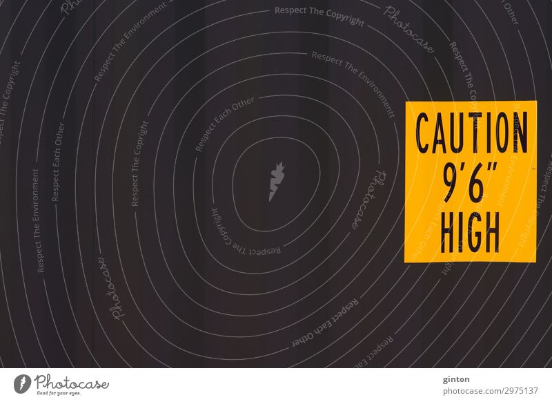 Container wall with sign Means of transport Logistics Trailer Steel Sign Characters Digits and numbers Sharp-edged Yellow Black container wall