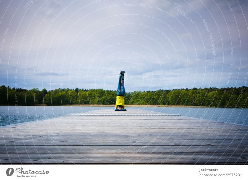 Headstand on the footbridge Yoga Woman Human being Nature Clouds Lake Jeans Sweater Footbridge Fitness Athletic Free Force Attentive Leisure and hobbies Idyll