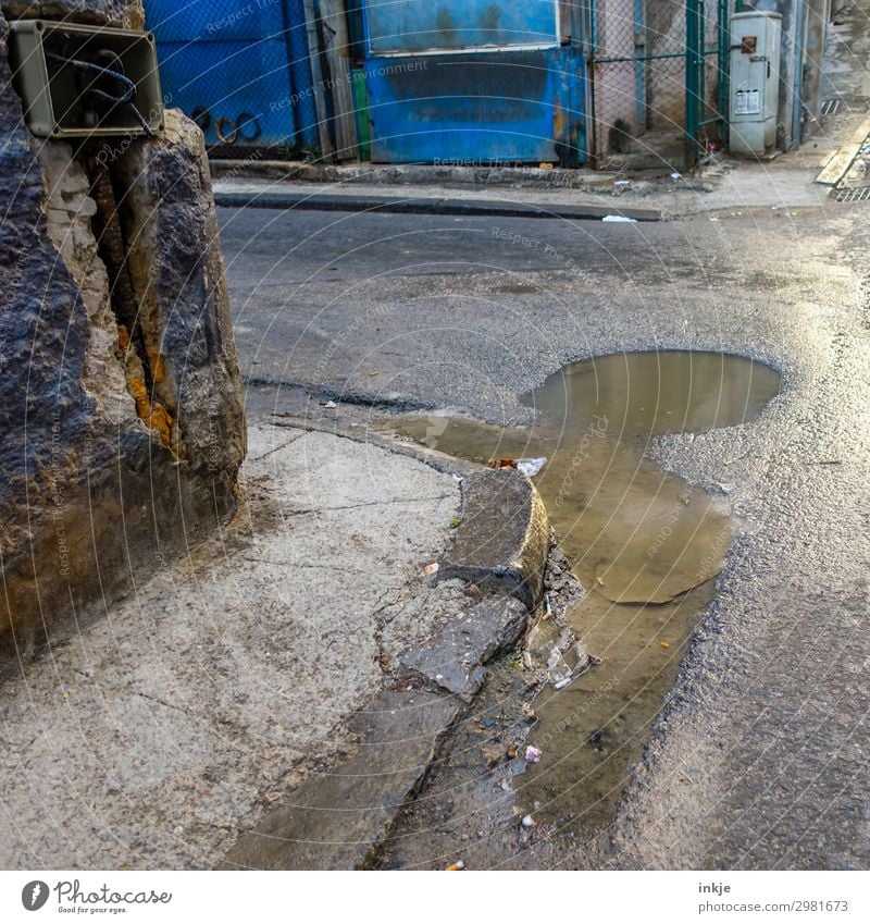 on the corner of Cuba Trinidade Small Town Deserted Transport Street Crossroads Road junction Puddle Old Poverty Authentic Derelict Dirty Wet Weathered Pavement