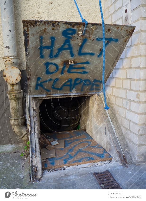 Shut up! written on a flappable flap Street art Neukölln Backyard Flap Rain gutter Metal Exceptional Dirty Brash Hideous Uniqueness Trashy Aggravation Grouchy