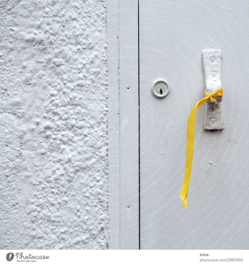 Patriotism (II) Wall (barrier) Wall (building) Door Door lock Door handle Sign Line String Knot Bow Hang Rebellious Yellow Gray Self-confident Passion